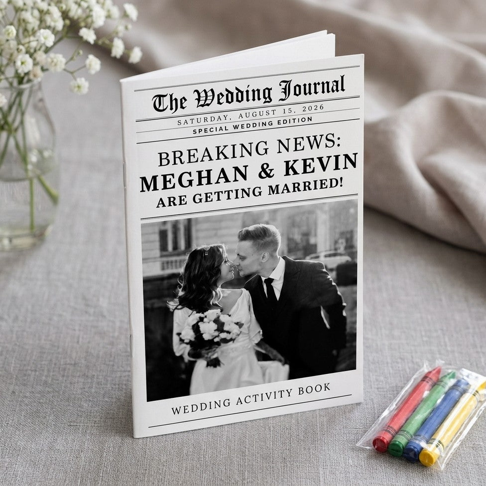 Meghan and Kevin wedding newspaper program activity book on linen with baby's breath and crayons