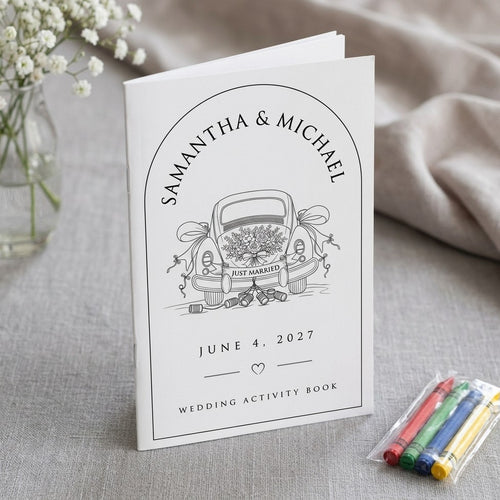 Samantha and Michael Just Married car design wedding activity book on linen with baby's breath and crayons