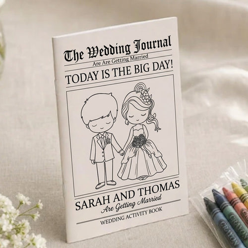 Sarah and Thomas wedding coloring book newspaper style cover on cream linen with crayons and baby's breath
