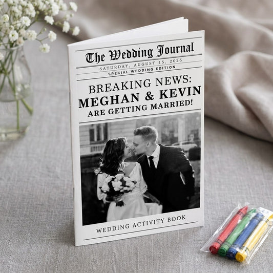 Meghan and Kevin wedding newspaper program activity book on linen with baby's breath and crayons