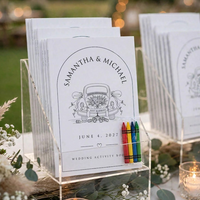 Booklets with crayons displayed outdoors at a wedding
